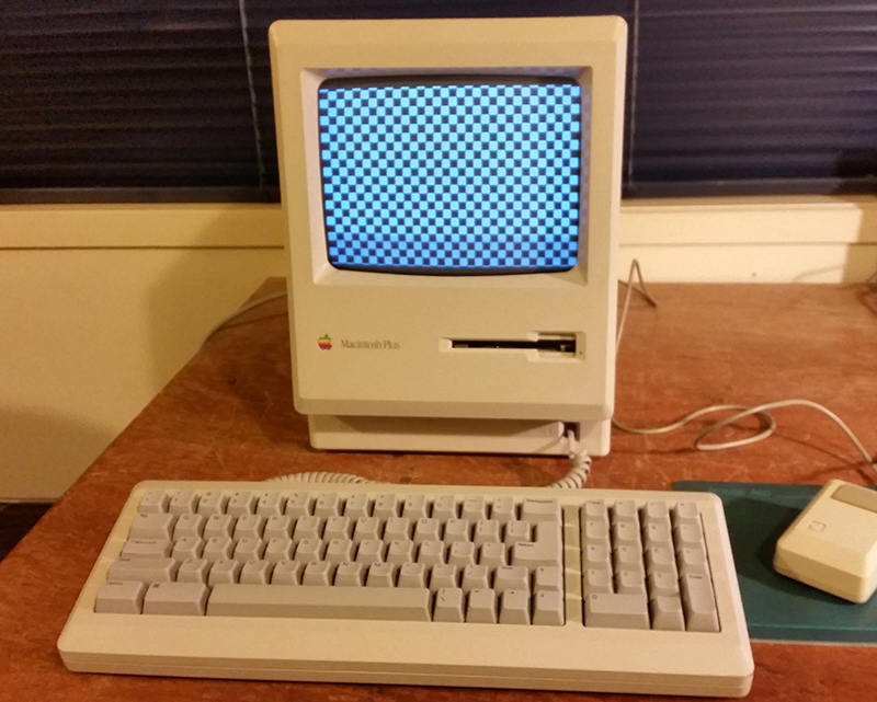 Mac Plus with checkerboard sceen